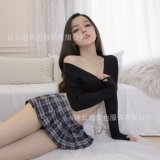 Black sweater + blue plaid skirt