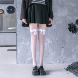 A pair of white bow-tie stockings