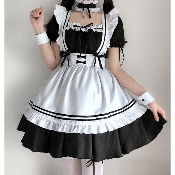 A cute maid costume featuring a black and white lolita outfit with a ruffled dress, petticoat, and accessories.