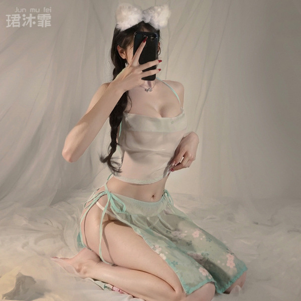 A woman poses with a smartphone, wearing an elegant ancient chinese style silk belly band bodysuit paired with a floral skirt...
