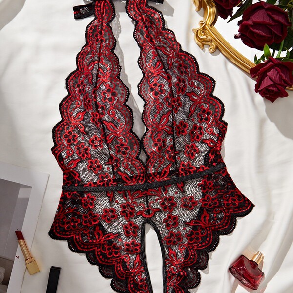 Deep v lace bodysuit with floral print, open-crotch backless design for women. elegant and sexy lingerie piece displayed on w...
