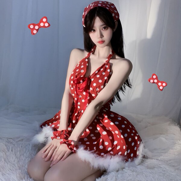 A woman wears a red polka dot dress with white fur trim, paired with matching headband and wrist cuffs, perfect for festive o...