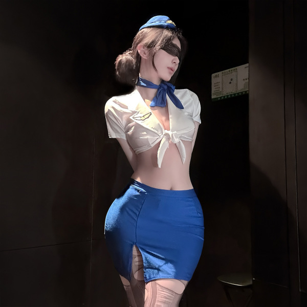 Woman wearing golden night air hostess lingerie set with sheer mesh top, blue high-waisted skirt, and matching hat.