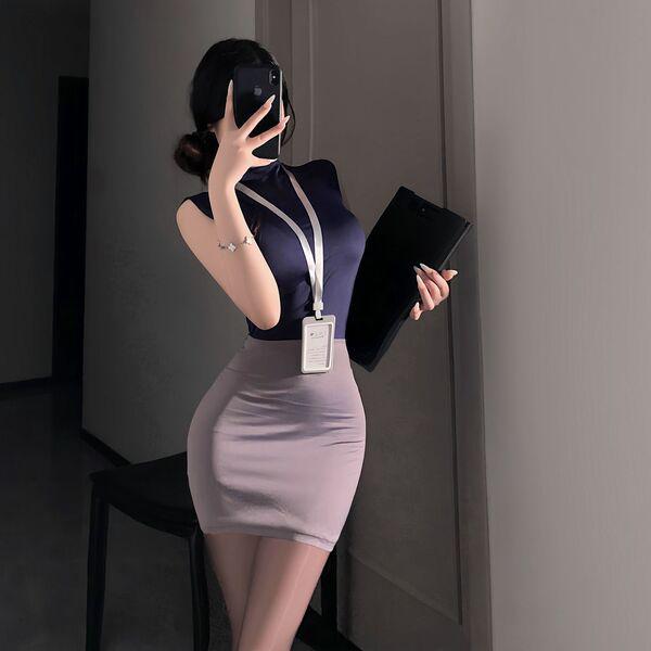 Woman in sleek secretary skirt and navy top, holding folder and phone, wearing id lanyard — pure & tempting lingerie set for ...