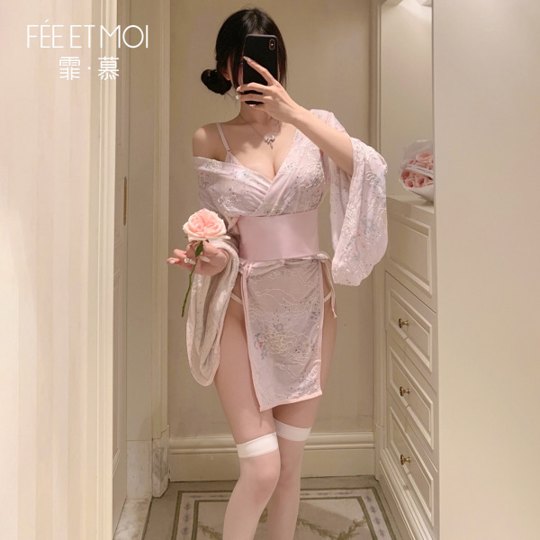 Woman in mirror wearing feimu japanese-style seductive side-open thong set — revealing cheeky 3-piece lingerie with no-remove...