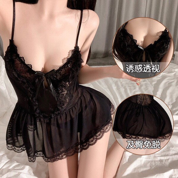 Woman wearing black lace sheer sleep dress with delicate detailing and flirty design, perfect for sweet and alluring loungewe...