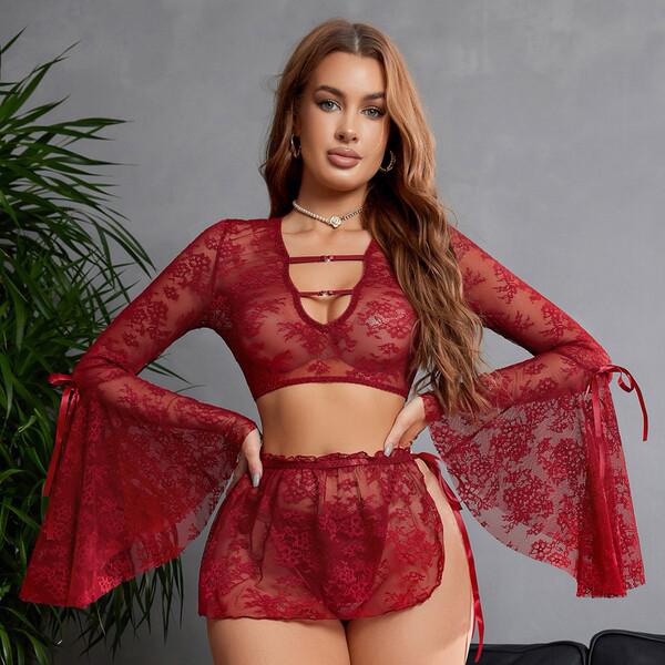 Woman modeling red sheer lace lingerie set with deep v, flared sleeves, and detachable ties.