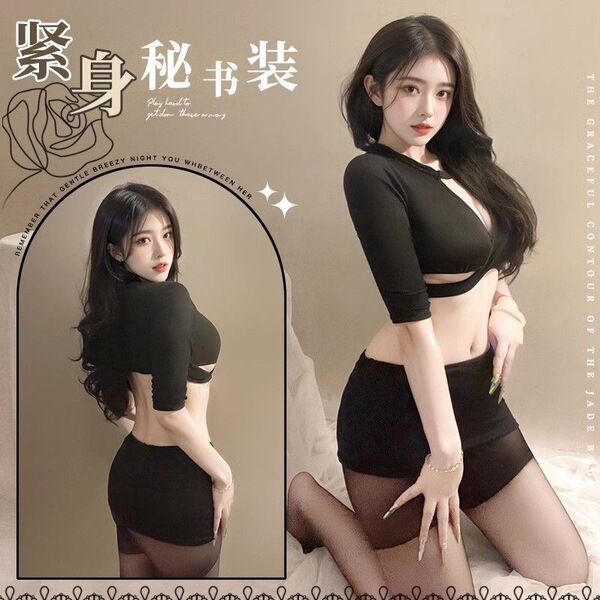 Woman modeling black plus size secretary style lingerie set with bodysuit and mini skirt for seductive sleepwear.