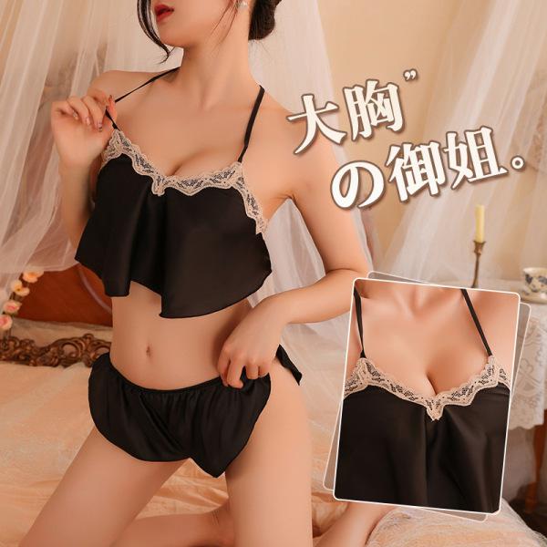 Woman modeling black sexy lingerie set with lace trim, featuring seductive sleepwear top and matching underwear shorts.