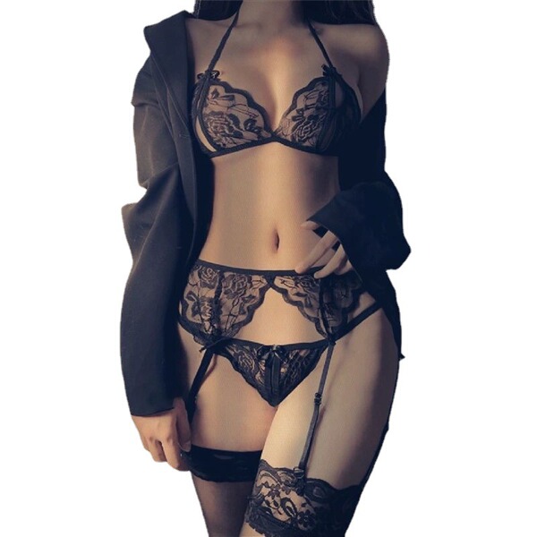 Woman wearing black lace lingerie set with garter belt, stockings, and open-crotch design — seductive 3-piece costume.