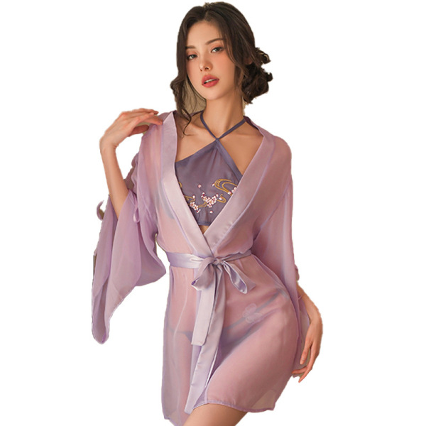 Woman wearing yaqin nu vintage belly dance set with sheer lavender robe, embroidered doudou top, and matching belt.