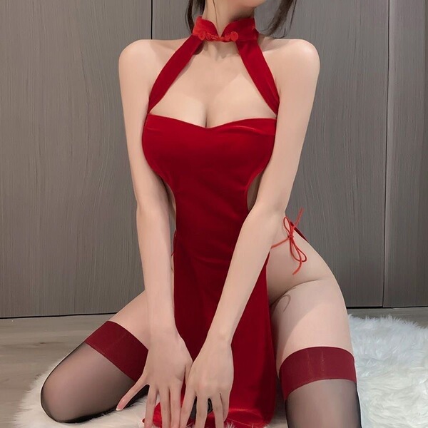 A woman wearing a red lace dress inspired by traditional chinese attire, featuring a high slit and open back design, exuding ...