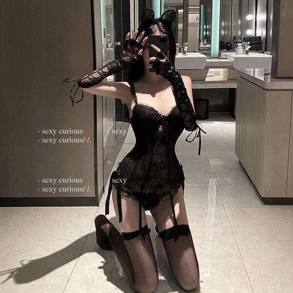 Seductive lace lingerie set featuring sheer mesh bodysuit and garter stockings, perfect for women seeking allure and elegance...