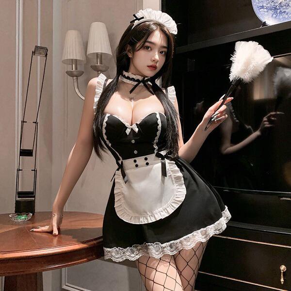 A woman poses elegantly in a black and white maid costume, featuring lace details and a fluffy feather accessory. the outfit ...