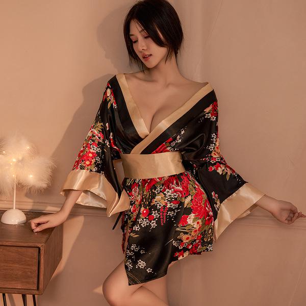 A woman poses elegantly in a black floral japanese kimono-style lingerie set, featuring a deep v-neckline and flowing sleeves...