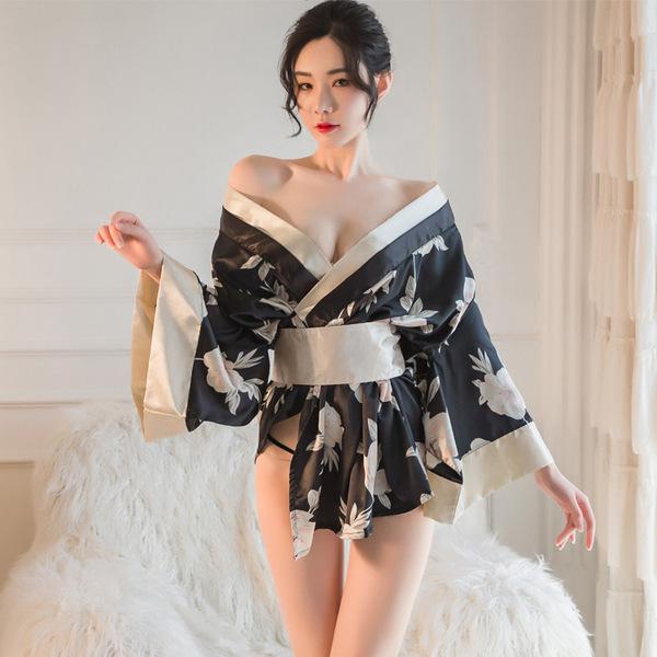 A woman models a japanese kimono-style lingerie set featuring a floral print, elegant design, and off-shoulder style, perfect...