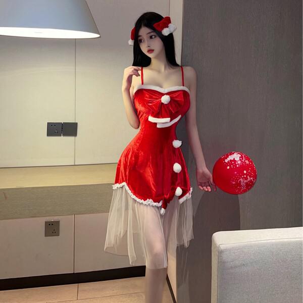 A woman poses in a festive red dress with white accents, featuring a bow and buttons, holding a red balloon. the outfit resem...