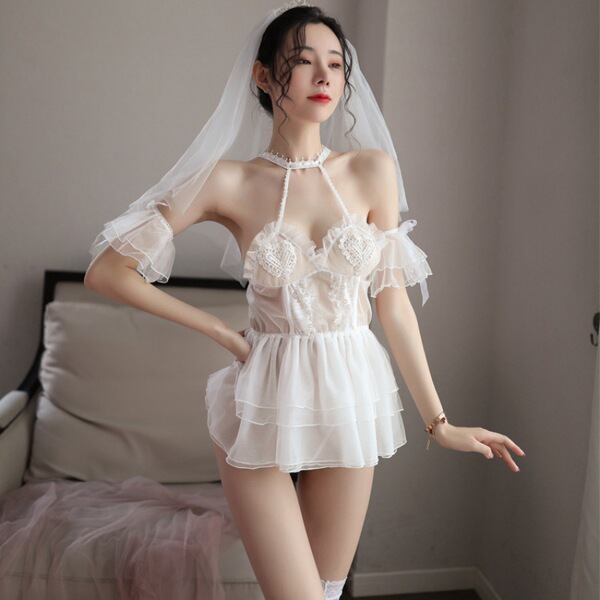 Woman wearing a white bridal lingerie set with lace details and a veil, embodying a sweet and innocent princess style for wed...