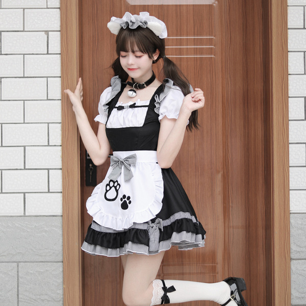 A stylish model poses in a classic black and white maid costume, featuring playful cat paw designs on the apron, perfect for ...