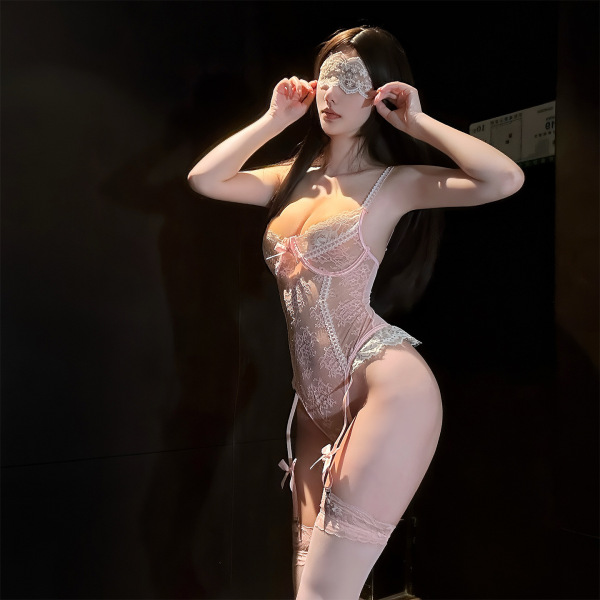 Woman wearing chaomu lace sensual bodysuit with sheer bust, lace detailing, and matching garter stockings.