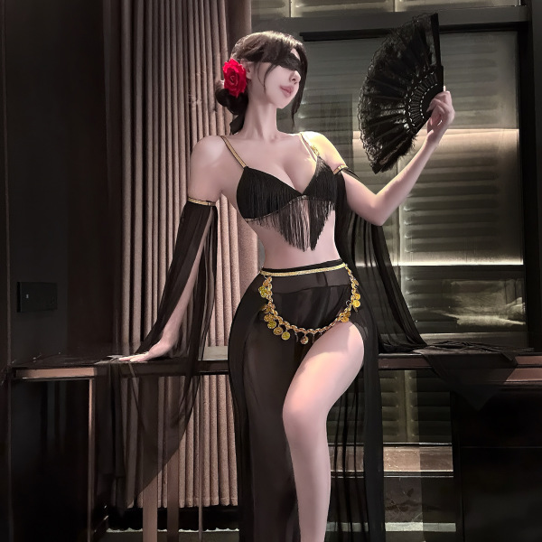 Woman in black fringe lingerie with gold accents, holding fan; elegant sensual set for couples.