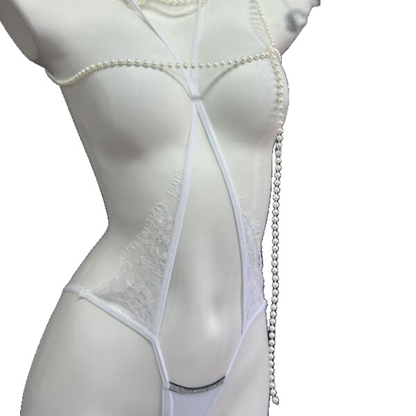 French-style lace mesh bikini panties featuring sheer cross-strap design with cotton crotch area, perfect for women seeking s...