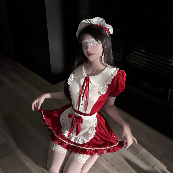 A woman poses in a maid cosplay outfit featuring a red and white dress with ruffles, lace details, and a bow tie. the ensembl...