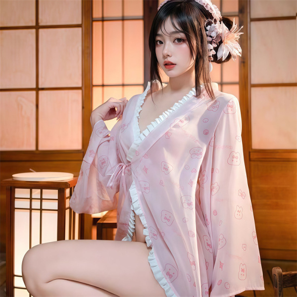 Woman wearing pink japanese kawaii bunny kimono robe with lace trim, bow, and floral print—sexy yet sweet lingerie set in tra...