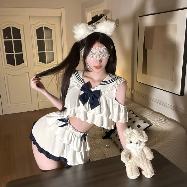Woman wearing jinxiao jk style flirty lingerie skirt with pleated mini design, lace eye mask, and fluffy headband.