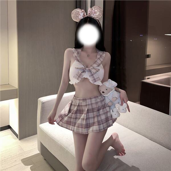 Woman in jk style lingerie set with plaid skirt and bow top, holding a teddy bear, perfect for playful role play.