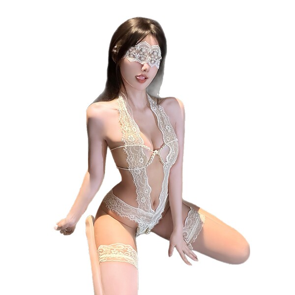 Woman wearing elegant lace pearl open-crotch lingerie set, featuring delicate floral patterns and a seductive design for inti...