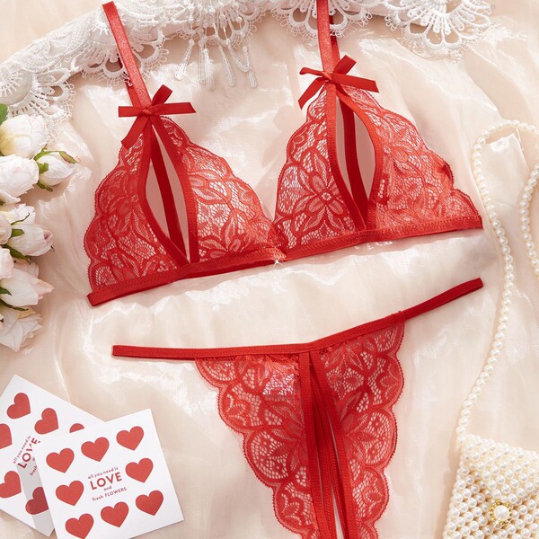 Sexy red lace sleepwear set featuring intricate patterns, delicate bows, and elegant design, perfect for women seeking premiu...