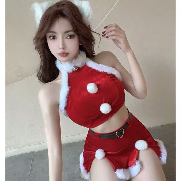 Sexy red velvet santa-themed lingerie set featuring a halter top with pom-poms and a mini skirt with lace trim and adjustable...
