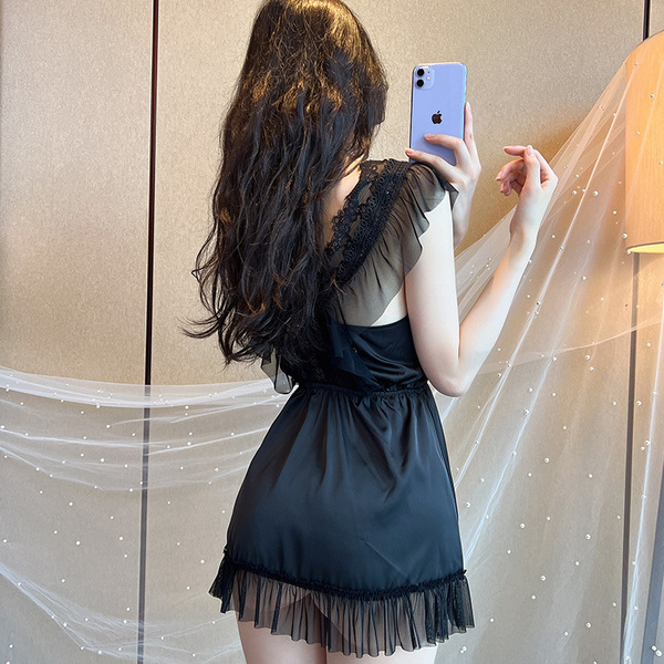 A woman takes a mirror selfie wearing a black mannyqing lace low-cut chemise sleep set, featuring sheer details and ice silk ...