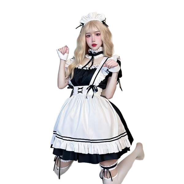 A woman poses wearing a miyano plus size japanese-style cosplay maid dress, featuring black and white colors with ruffles and...