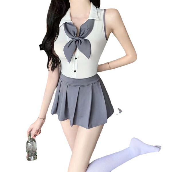 A woman models a naben sexy small-bust jk uniform set featuring a white bodysuit with a large gray bow tie and pleated skirt,...