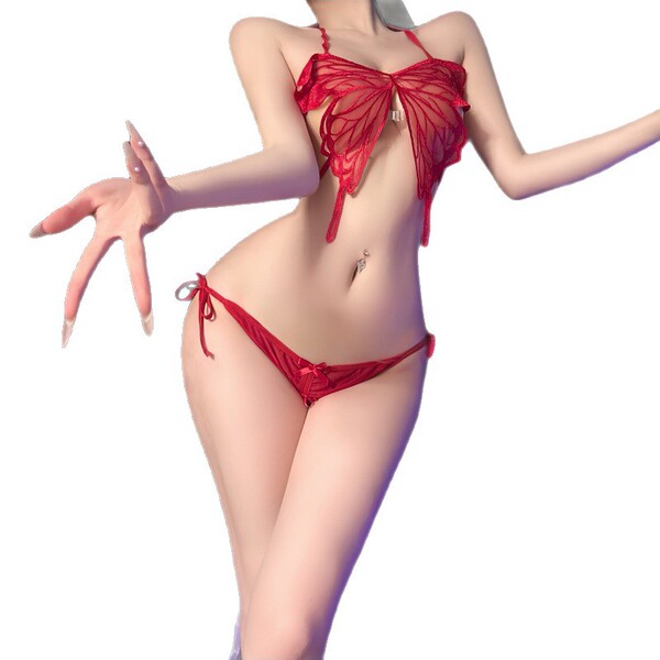Woman modeling red lace butterfly bikini set with harness details, sensual belly dance style outfit for intimate wear.