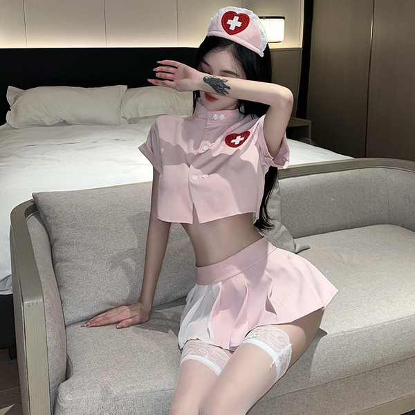 Sexy nurse costume set featuring a pink cropped top, matching skirt, and cap with cross emblem, perfect for role play and cos...