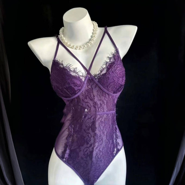 Purple lace lingerie set with thin straps and floral details, styled on a mannequin with pearl necklace.