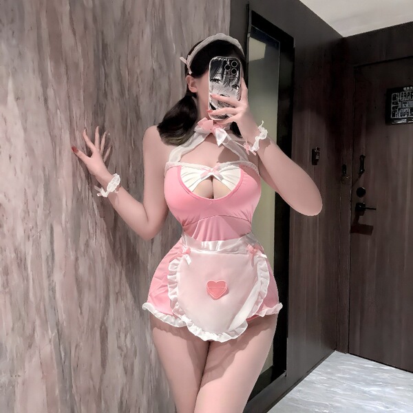 Pink plus size maid costume with open-crotch design, featuring ruffled apron and bow details for adults.