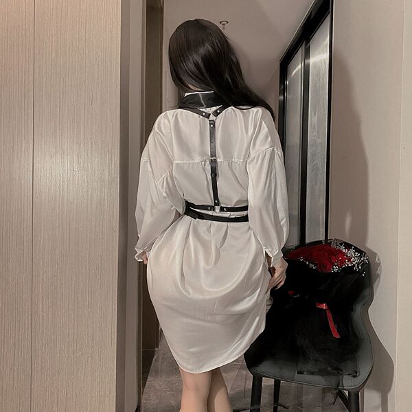 Elegant white dress with black leather accents, featuring a harness design and strappy details, perfect for an edgy adult fet...