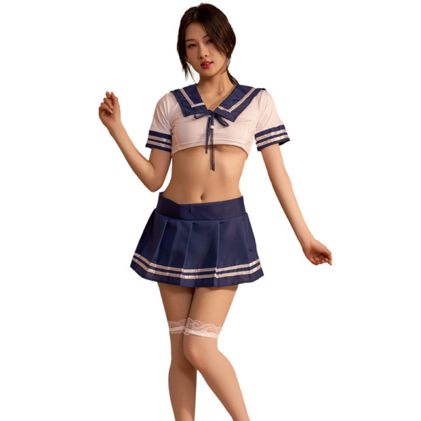 Woman modeling pure & playful lingerie set: sexy student-style uniform sleepwear with navy skirt, crop top, and lace thigh-hi...