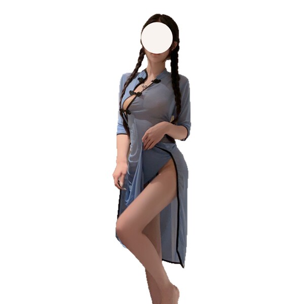 A woman models a light blue lace cheongsam dress with a high slit and plunging neckline, perfect for romantic evening wear.