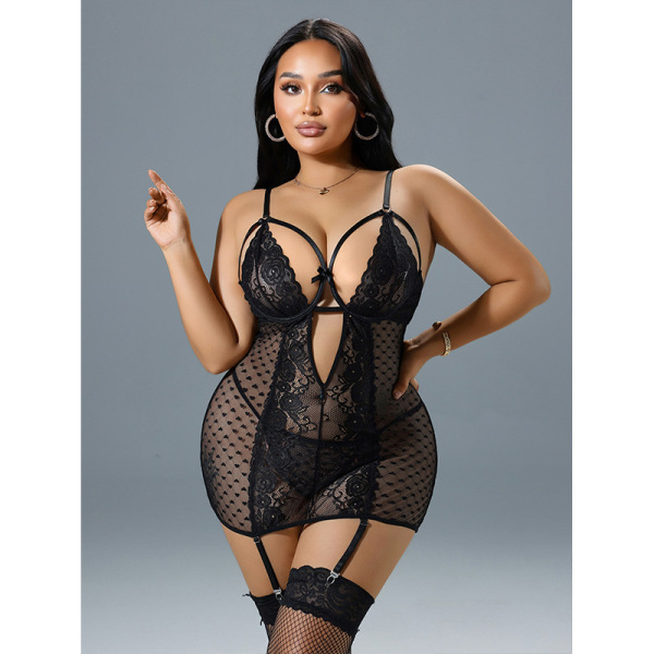 Woman modeling black lace lingerie set with sheer push-up bra and garter stockings.