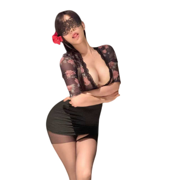 Woman in black floral lingerie set with lace mask, showcasing elegant and sensual design.