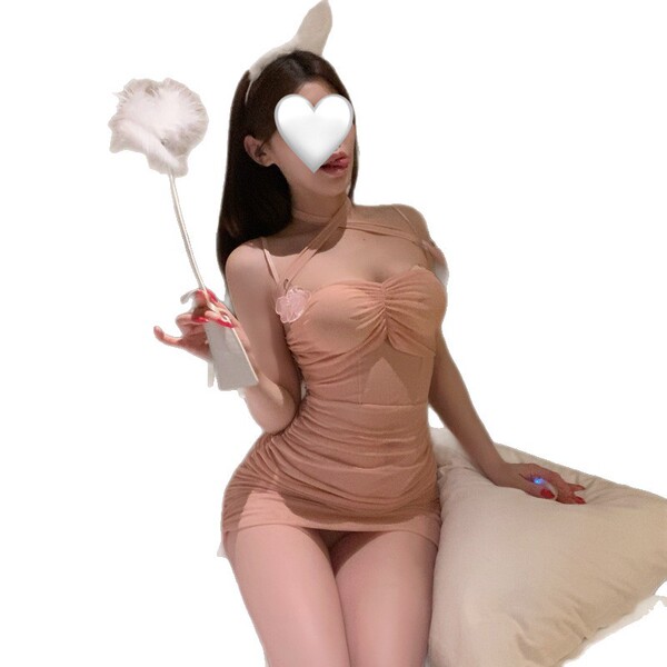 Woman in beige lingerie set with bunny ears, holding a fluffy wand, sitting on a pillow. pure & seductive lingerie set - mode...