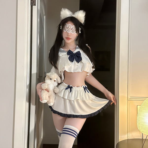 A stylish model showcases the qingshe jk flirty lingerie set, featuring a pleated skirt with elegant details and playful cat ...