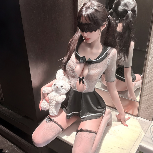 Woman in qingshe jk sailor lingerie with mesh bodysuit, holding teddy bear.