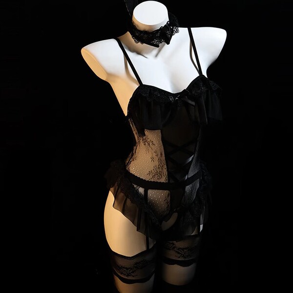 Black lace lingerie set with sheer bodice, garter straps, and matching choker on mannequin.
