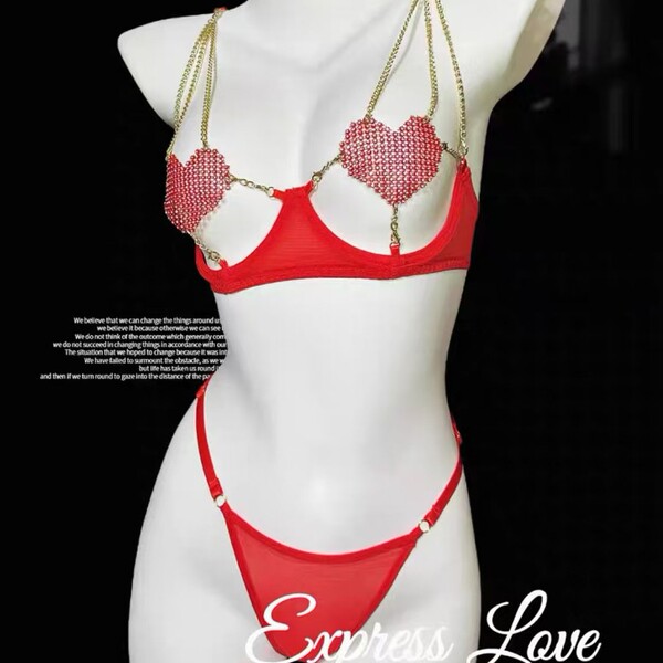 Red lace bra set featuring heart embellishments, sheer details, and push-up design for stylish lingerie appeal.